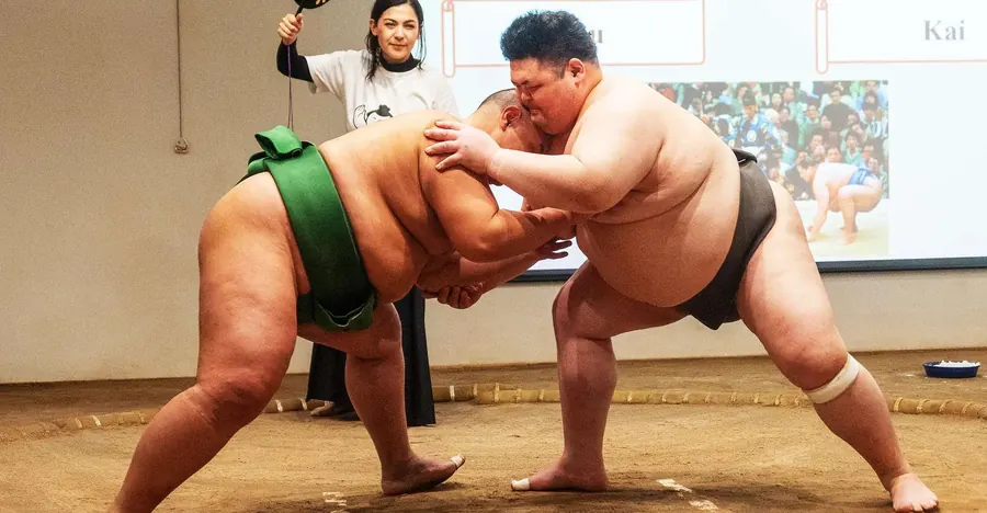 Hands-on sumo experience at Sumo Studio Osaka — audience steps into the ring with retired wrestlers in Nishinari Ward